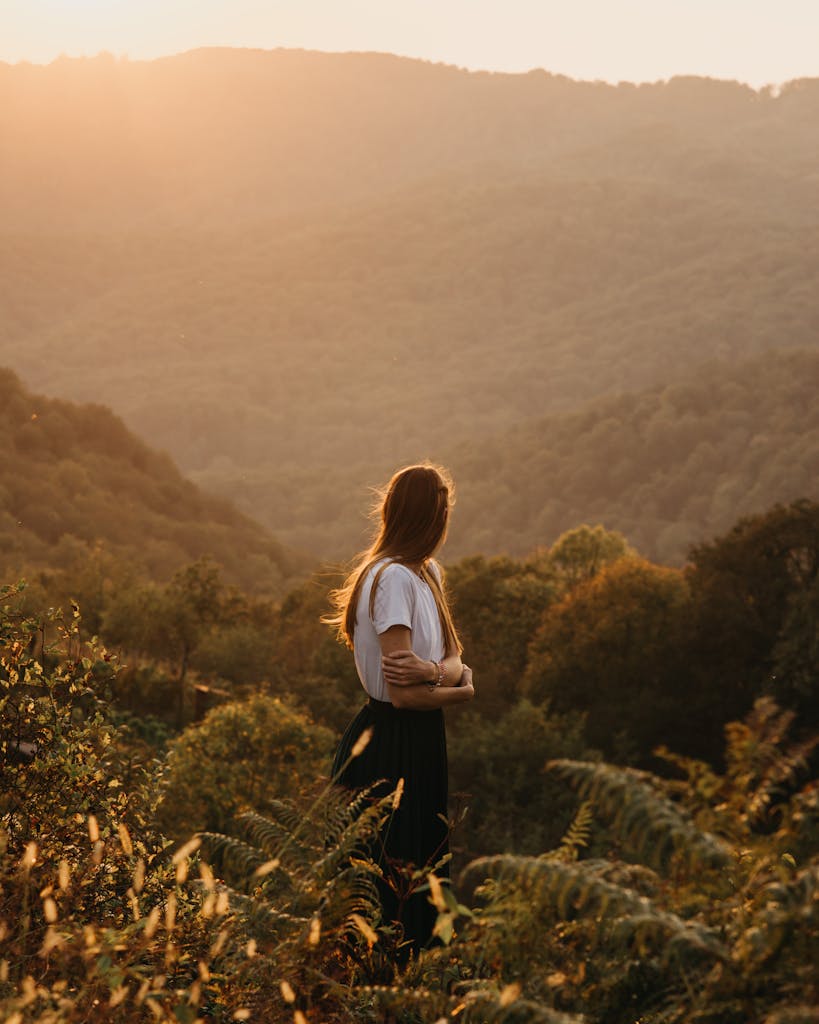 Woman standing in mountainous valley